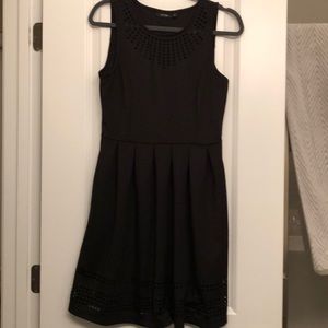 Black dress with laser cutout.